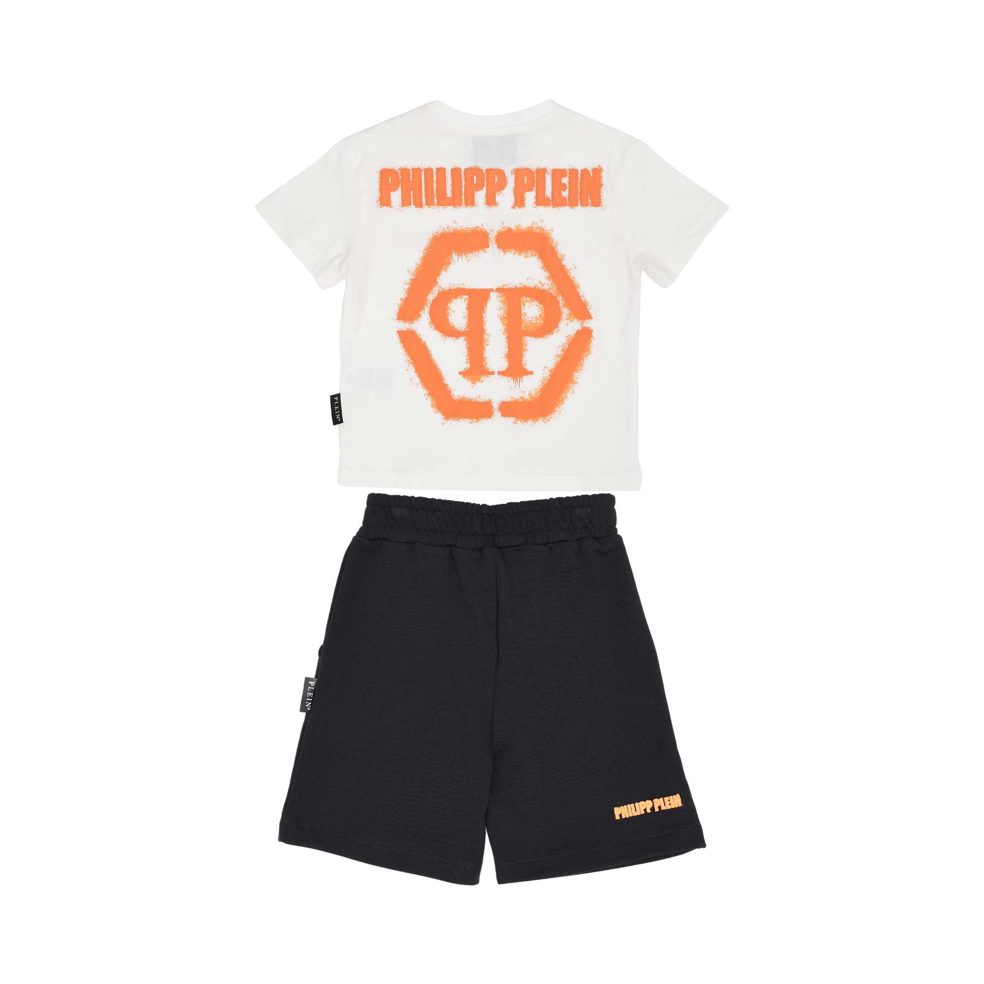 Back view of the Philipp Plein Junior set, highlighting the large orange spray-effect hexagonal logo on the t-shirt and script branding on the shorts.