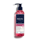 Front studio shot of Phyto Boucles Intenses Curl Defining Gelée 250ml, available at Blue Salon Online. The clear cylindrical pump bottle showcases its translucent gel formula, featuring a clean white label with soft peach accents under a metallic silver pump mechanism.