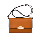 Brown leather handbag with a black strap on a white background.