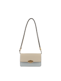 Front view of the Pourchet leather shoulder bag featuring a beige flap, light blue base, and an adjustable shoulder strap with gold-toned buckles.