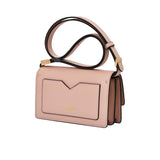 Pink handbag with a black strap on a white background.