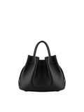 Back view of the Pourchet bucket bag in black leather, displaying the elegant curved silhouette and top handle design.