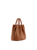 A three-quarter view of the camel pebbled leather Pourchet bag, highlighting the top handles and gold-tipped drawstring closure.