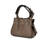 Side view of the Pourchet Blossom bag  pebbled leather, featuring a decorative knotted leather tie and a gold-toned D-ring attachment.