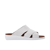 Profile shot of Prestige white suede criss-cross slide sandals featuring a thick white cushioned sole and brown leather footbed.