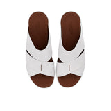 Bird's eye view of the sandals showing the "PRESTIGE MADE IN ITALY" branding on the brown leather insoles.