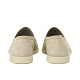 A rear view of the pair of beige suede loafers, showcasing the heel counters. The discrete "GP" logo is embossed on the outer side of each heel, and the clean stitching along the top collars is visible, alongside the stamped size "37" on the interior lining.