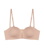 Product-only view of the Triumph Flex Smart beige non-wired bra with detachable straps and a smooth, seamless finish. Shop Online Today