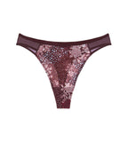 Product-only view of the Triumph Lavish Spotlight burgundy high waist thong, showcasing the intricate lace embroidery and sheer mesh details. Now Available Online