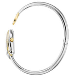 A side profile view showing the precise curvature of the silver bangle, the thickness of the crystal-set gold rim bezel, and the gold-plated fluted crown.