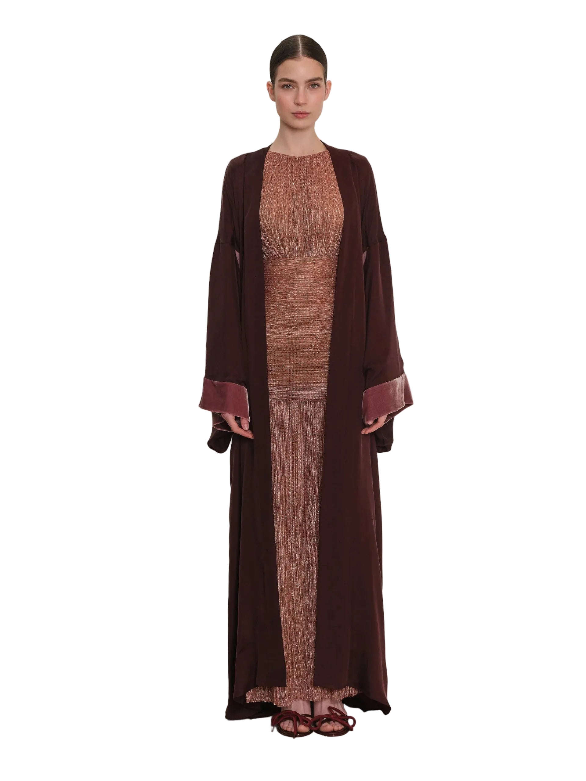 Burgundy open-front abaya with wide sleeves and lighter burgundy velvet cuffs, worn over a rose gold ribbed inner dress with