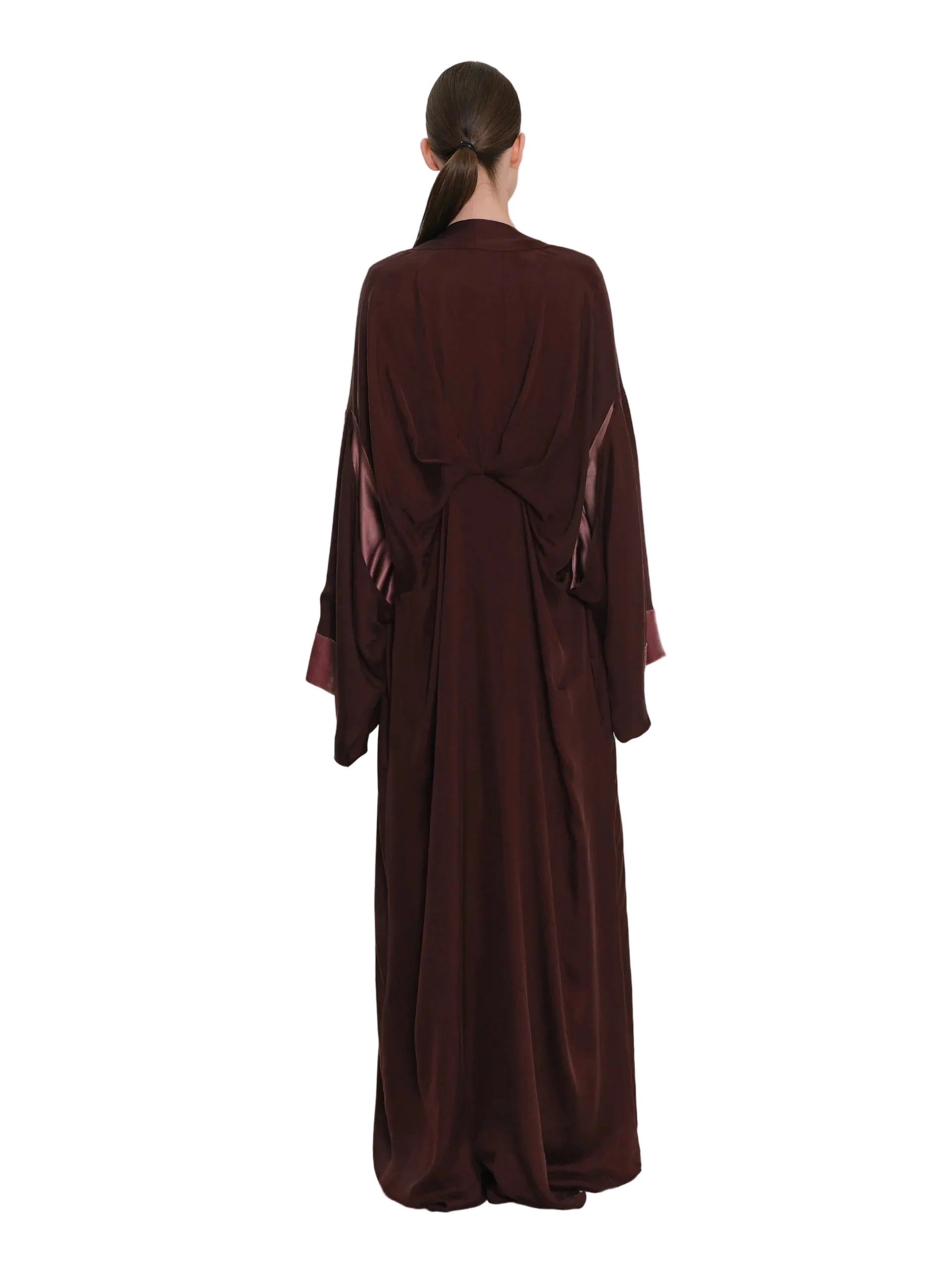 Full-length burgundy abaya with wide sleeves and a draped back, featuring dusty rose satin-like inner sleeve panels.