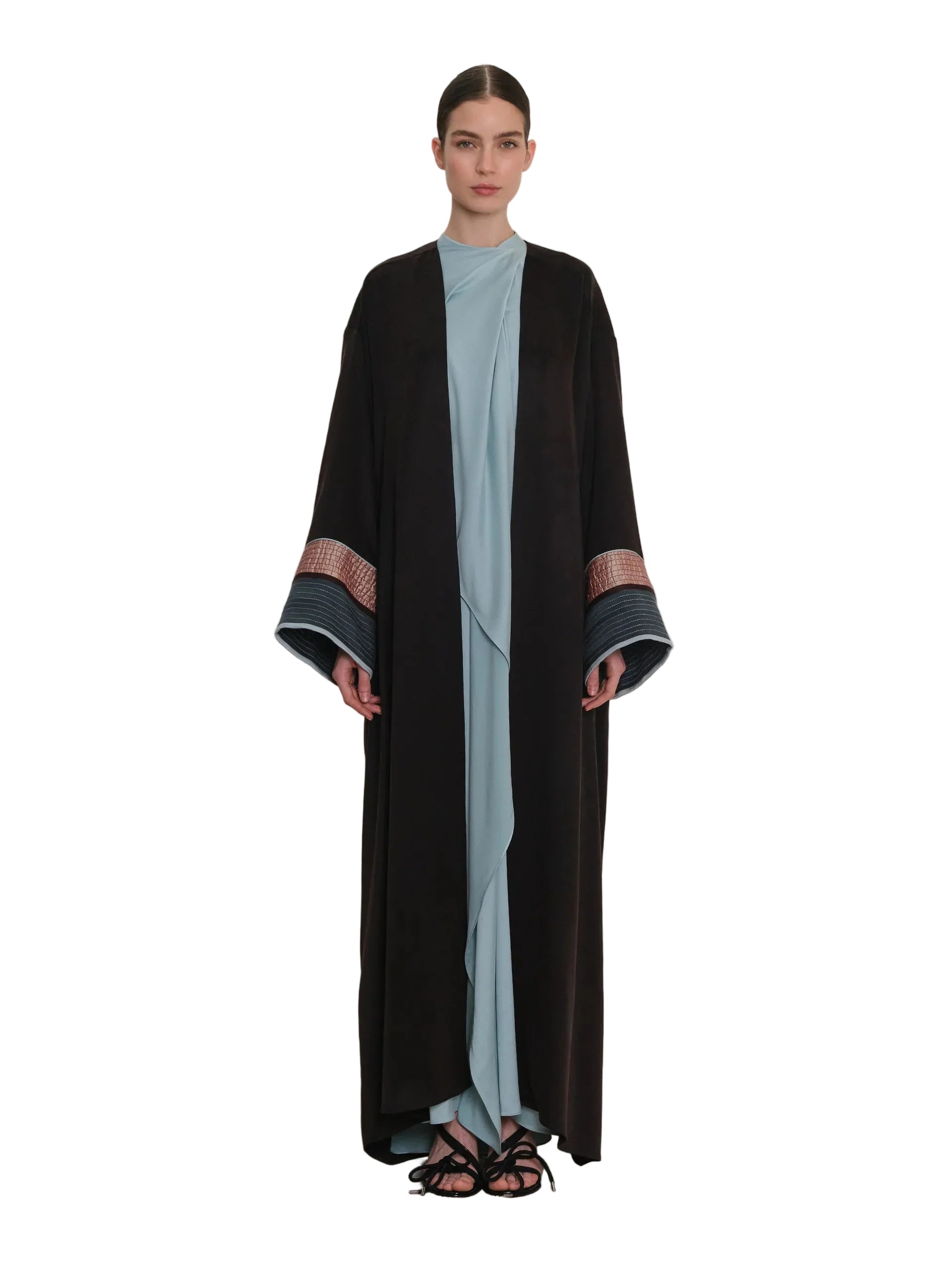 Black open-front abaya with wide sleeves and patterned cuffs featuring horizontal stripes and textured details.