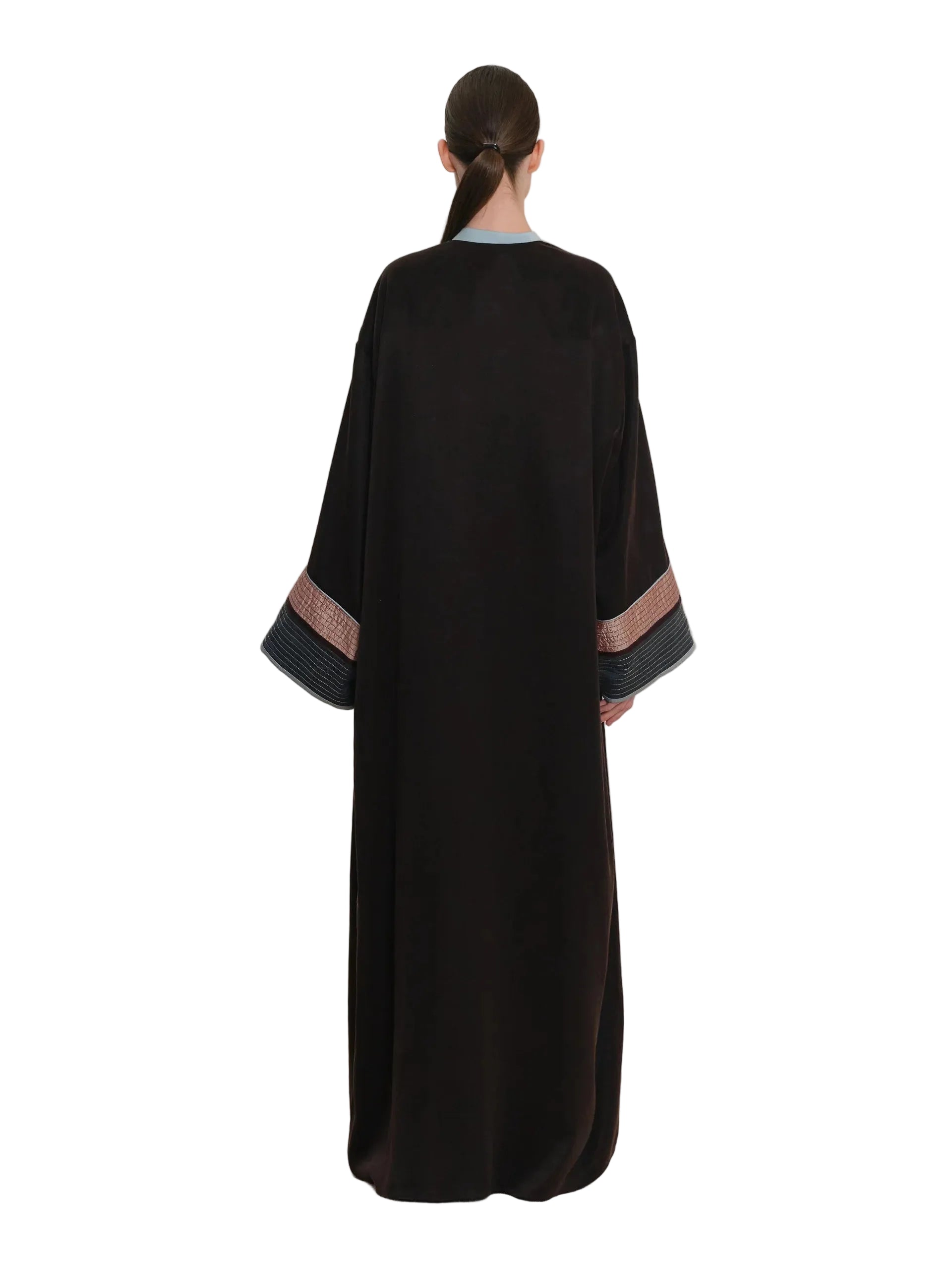 Black abaya with wide sleeves. The sleeves have patterned cuffs with horizontal stripes in brown and dark grey. Light blue tr