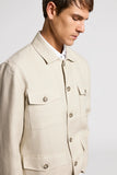 Beige pure linen Saharan jacket with a collar, button-up front, and four flap pockets with mottled brown buttons.