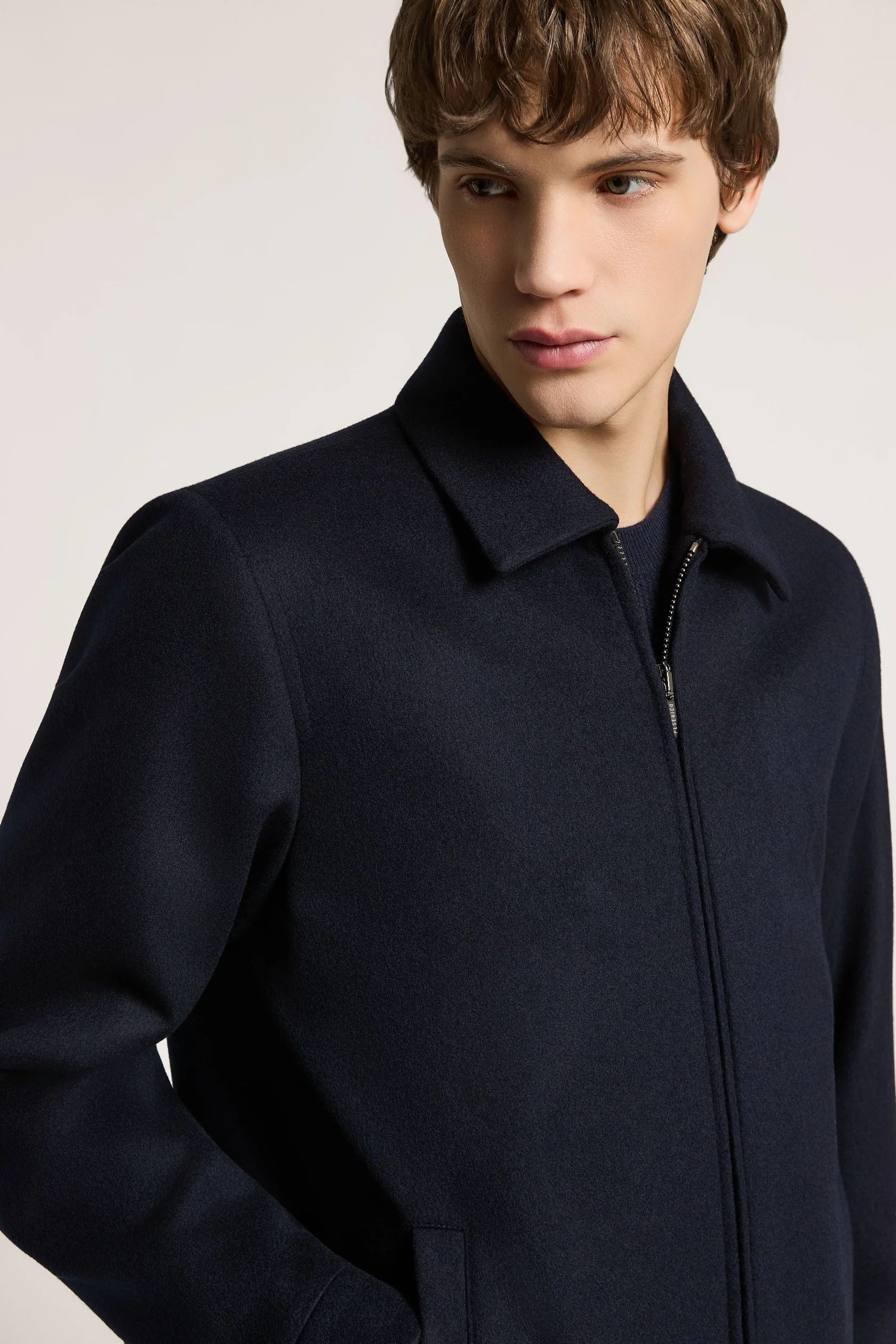 Galaxy blue collared jacket with a full silver-toned zipper down the front and long sleeves. Made of a textured fabric.
