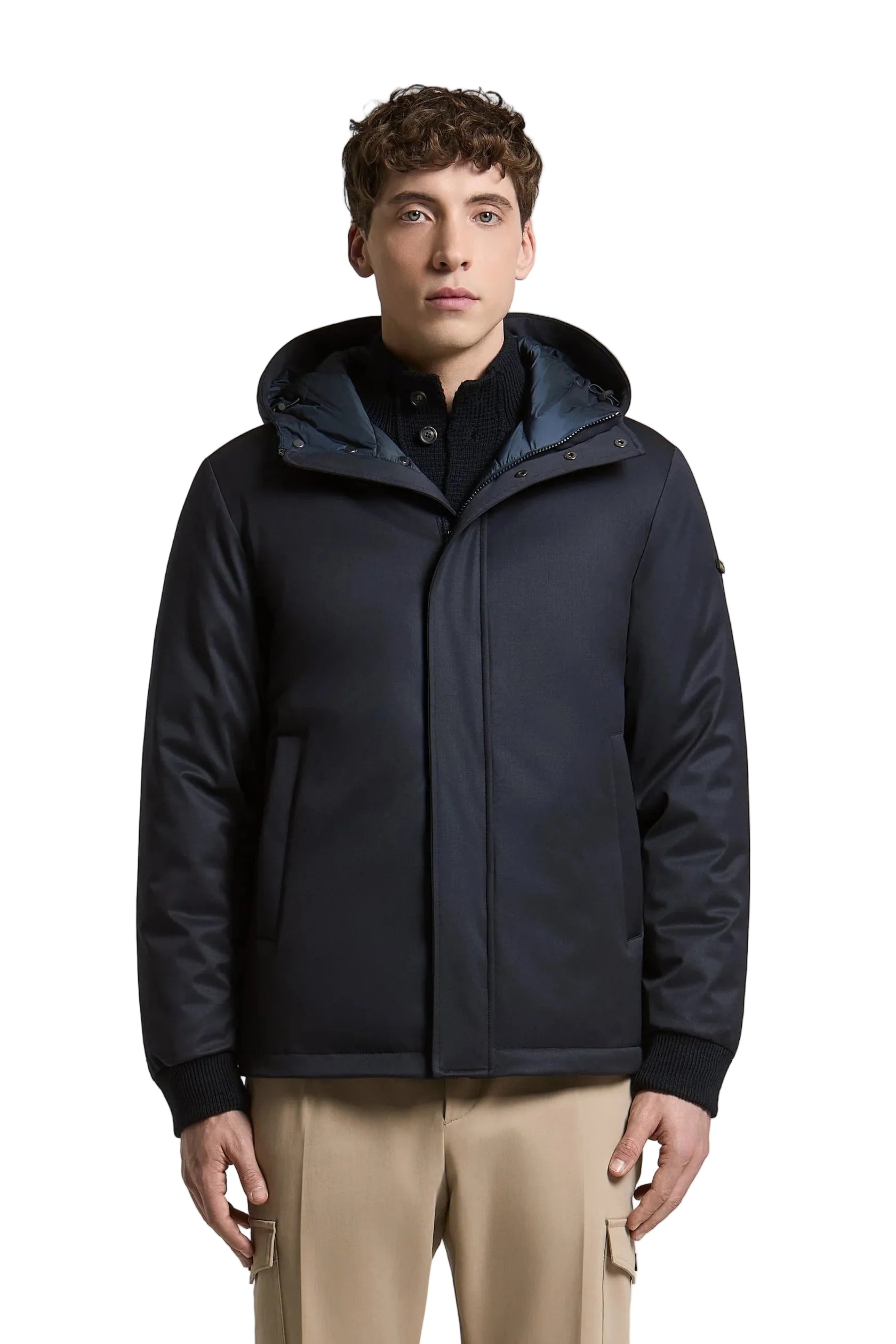 Dark blue men's hooded jacket with a smooth outer fabric, a padded inner hood, concealed front closure, and ribbed cuffs.