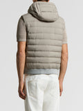 Taupe padded vest with horizontal quilting, an attached hood, and a ribbed hem.