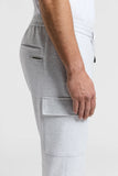 Light grey jersey cargo trousers with an elasticated drawstring waist, a back welt pocket, and a flap cargo pocket on the lef