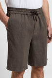 Brown linen canvas jogger Bermuda shorts with an elasticated, ruched waistband, dark brown drawstring, and side pockets.