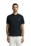 Navy blue short-sleeved piqué knit polo shirt with a two-button placket and white striped cuffs.
