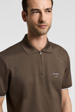 Brown piquet polo shirt with a half-zip placket, silver-toned zipper, and white stripe on the short sleeve cuffs. "PESERICO 1