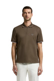 Brown short-sleeved piquet polo shirt with a quarter-zip placket and white contrasting trim on the cuffs.