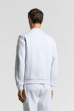 Light grey heathered cotton jersey bomber-style sweatshirt with a ribbed collar, cuffs, and hem. Small dark patch on left sle