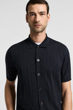 Dark blue cotton and silk knitted shirt with vertical ribs, short sleeves, a pointed collar, and a button-front placket with