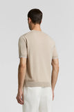 Beige pure cotton short-sleeved T-shirt with ribbed crew neck, raglan sleeves, and white-trimmed ribbed cuffs and hem.