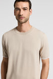 Beige pure cotton fine knit T-shirt with a ribbed crew neck and ribbed short sleeves featuring a thin white stripe at the cuf