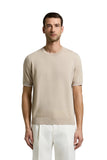 Beige pure cotton short-sleeved T-shirt with ribbed crew neck, cuffs, and hem.