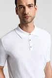 White pure cotton short-sleeved polo shirt with a textured diamond pattern, classic collar, three-button placket, and light b