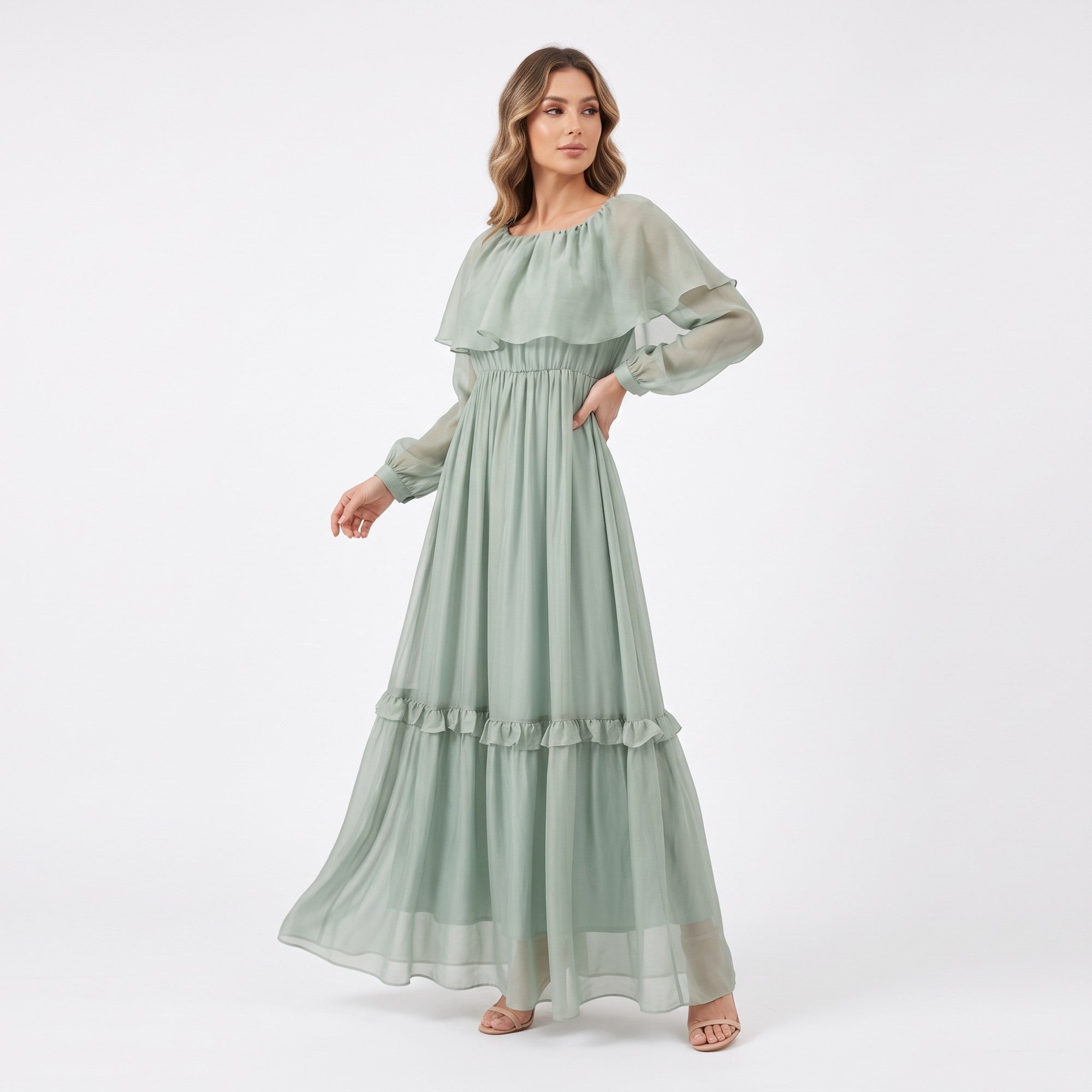 Sage green maxi dress with a gathered round neck, ruffled overlay, sheer long sleeves, elasticated waist, and tiered skirt wi