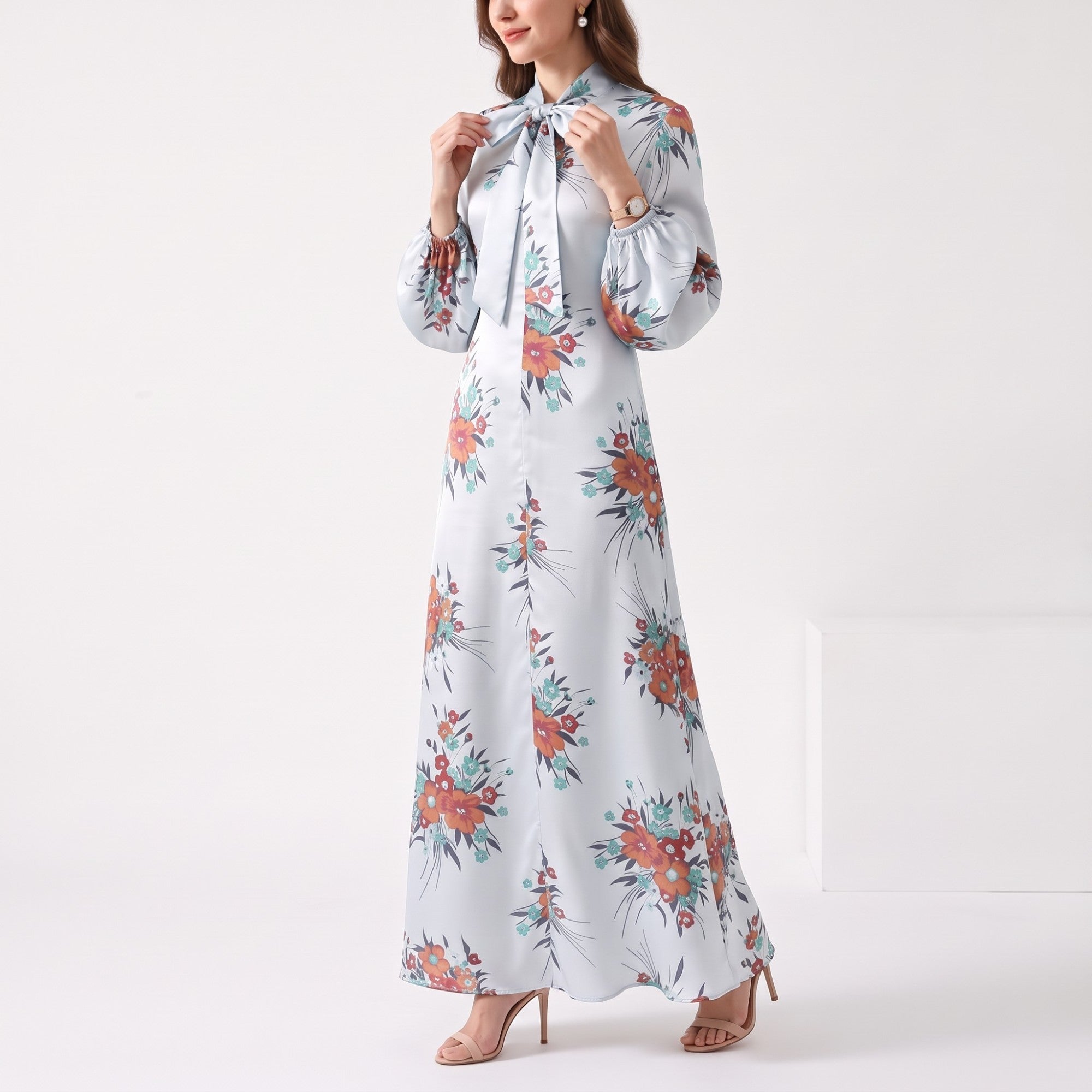 Light blue floral maxi kaftan with a pussy-bow tie neck and long puffed sleeves with elasticated cuffs.