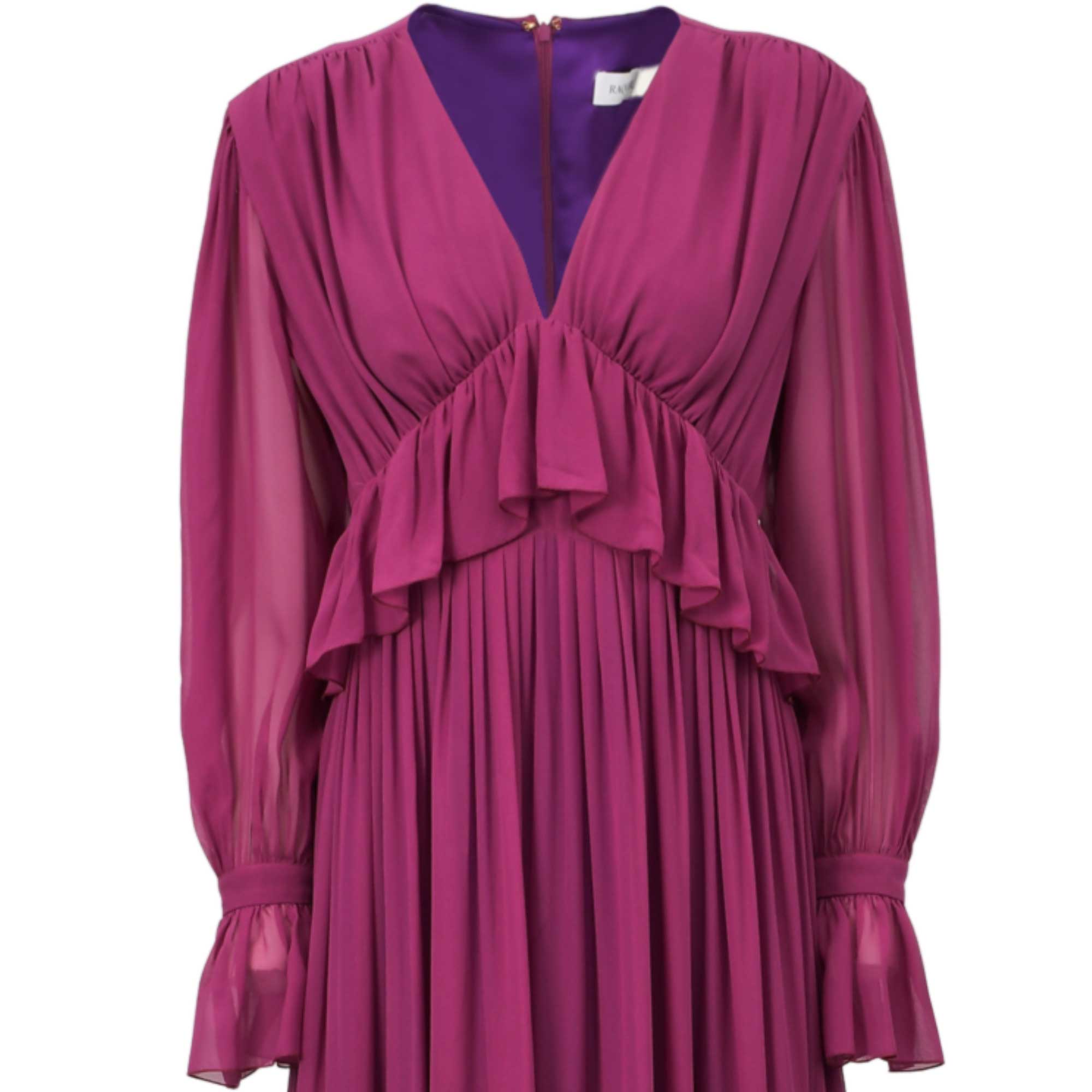 Fuchsia V-neck dress with sheer long sleeves, ruffled bust, pleated skirt, and ruffled cuffs. Dark purple lining at neck.