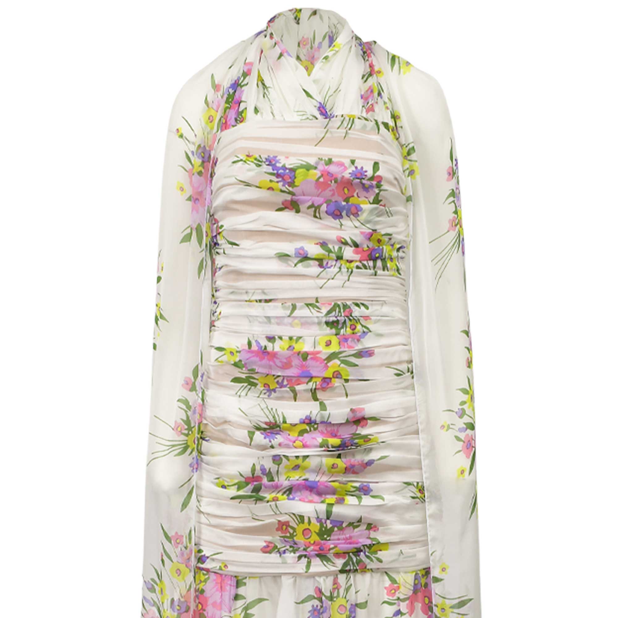 White sheer floral dress with yellow, pink, and purple flowers. Features a ruched strapless bodice and a matching draped scar