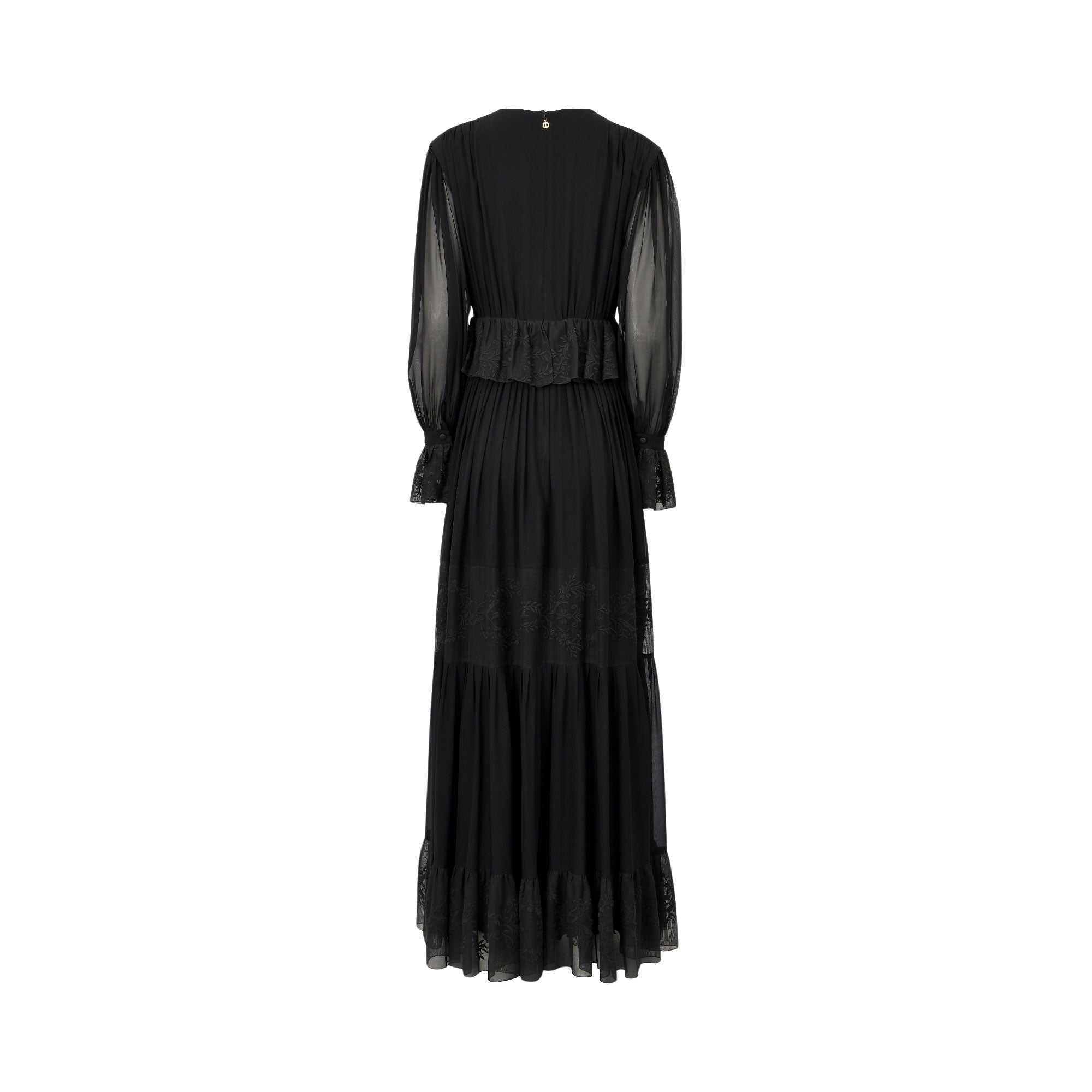 Black maxi dress, back view. Sheer long sleeves with ruffled lace cuffs. Ruffled peplum waist, tiered skirt with lace. Gold-t