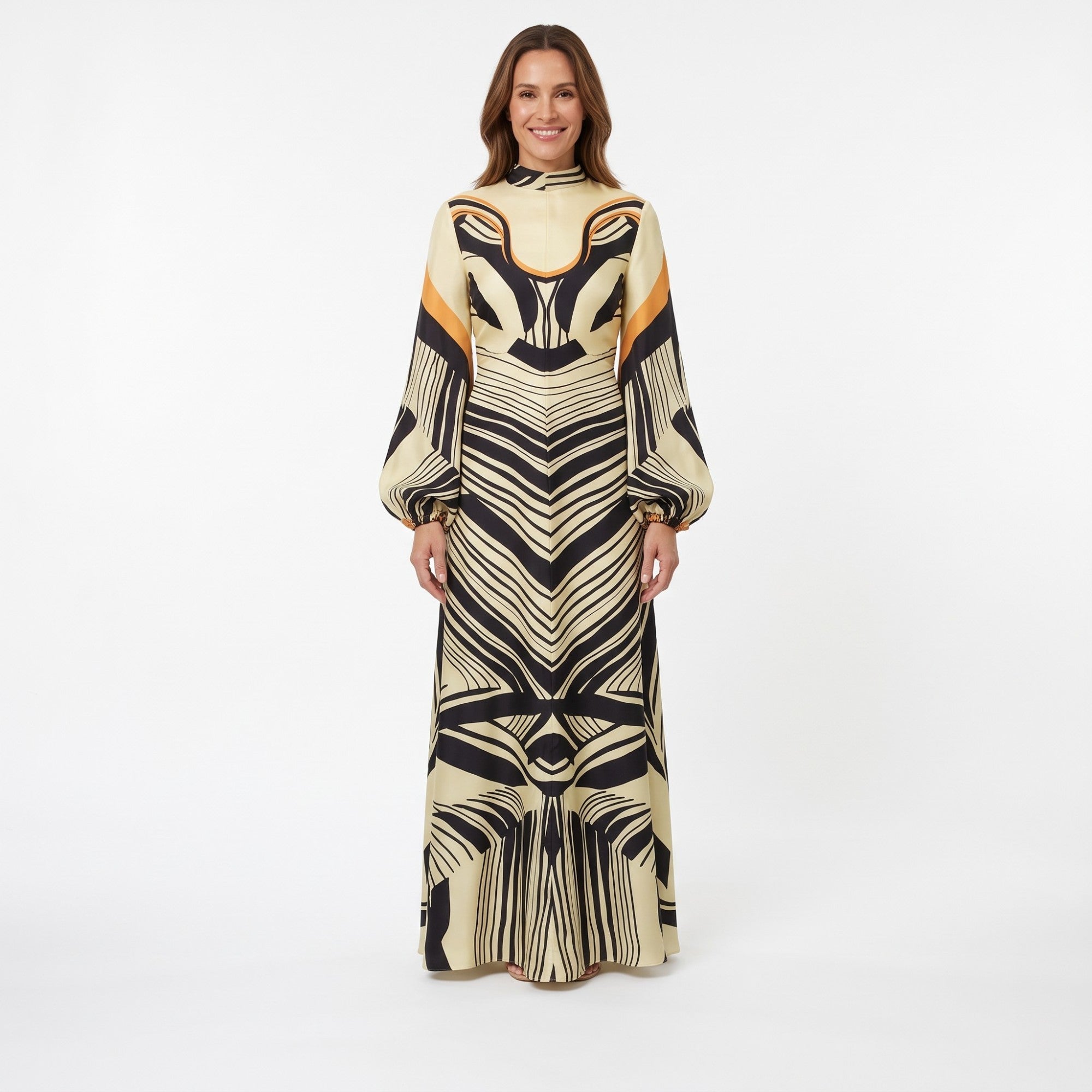 Ivory kaftan with black abstract patterns and tangerine accents. Features a high neck and long balloon sleeves with elastic c