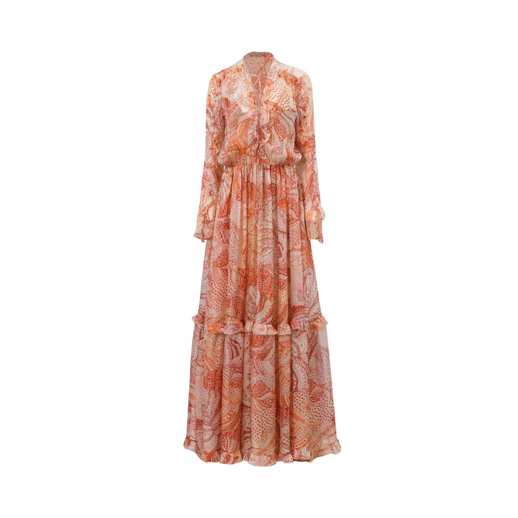 Maxi dress in multi-tonal coral, orange, and cream paisley pattern, with long sleeves, tiered skirt, and lace-up V-neck.