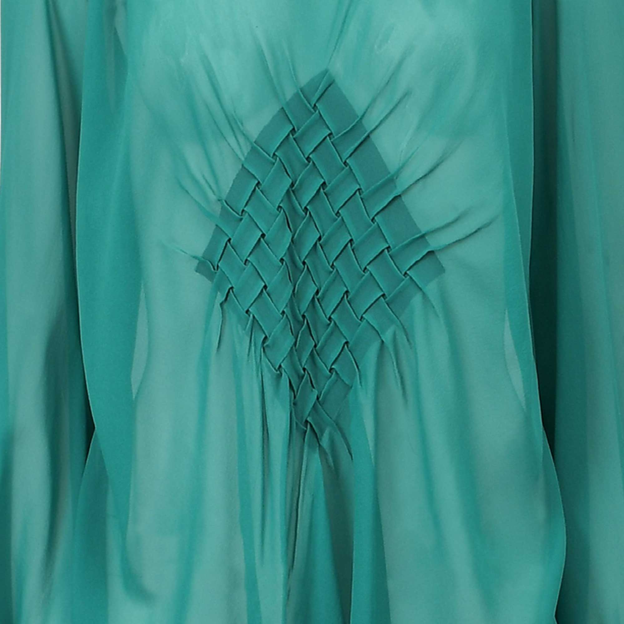 Sheer teal green top with a central diamond-shaped woven fabric detail.
