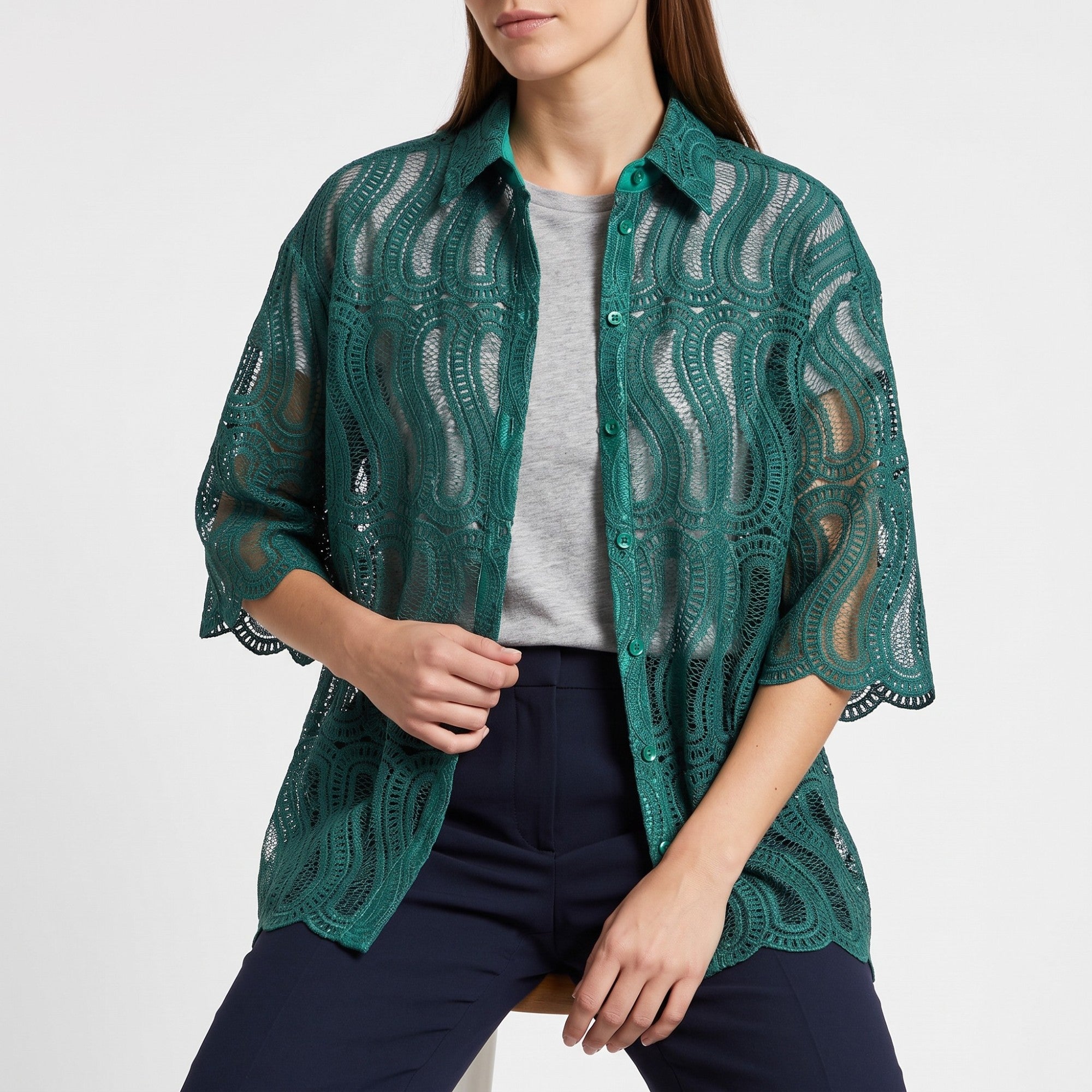 Green sheer lace button-up shirt with a wavy pattern, pointed collar, 3/4 sleeves, and scalloped cuffs.