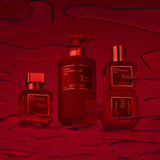 Baccarat Rouge 540 set: perfume, large cleansing gel pump, and two stacked square body oil and hair perfume. All gold-toned c