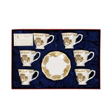 Top-down view of the 12-piece Royal Family tea set, showing six cups and matching saucers neatly arranged in a blue satin-lined gift box.