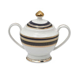RICHFINE luxury porcelain dinnerware set featuring navy blue and gold textured borders, including plates, bowls, tea pot, soup tureen, and serving platters on a white background.