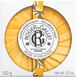 A round, pleat-wrapped Roger & Gallet Bois d'Orange Wellbeing Soap in its square white box with an orange illustrated central seal, from Blue Salon Online.