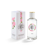 Roger & Gallet Rose Wellbeing Fragrant Water 100ml clear glass bottle next to its white box featuring pink rose illustrations, available on Blue Salon Online.