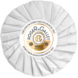 Roger and Gallet Paris perfumed round soap individually wrapped in its signature white sun-shaped pleated tissue paper with a central gold and black logo seal.