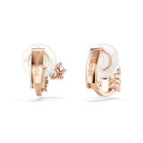 A detailed rear product view of the Swarovski Matrix clip-on earrings, highlighting the polished rose gold-plated clip backs engraved with the brand logo and fitted with soft white silicone pads.