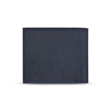 Rear view of the closed wallet, showing the uniform texture of the linear wave-patterned dark blue leather and the fine perimeter stitching.